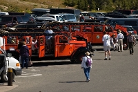 DSC_1992_Logan_Pass_Parking_Lot The parking lot at the Logan Pass visitor center in Glacier National Park is often full, so try to get there early in the morning, or late in the afternoon. Or take a tour on one of the long red beautifully restored old Ford busses.